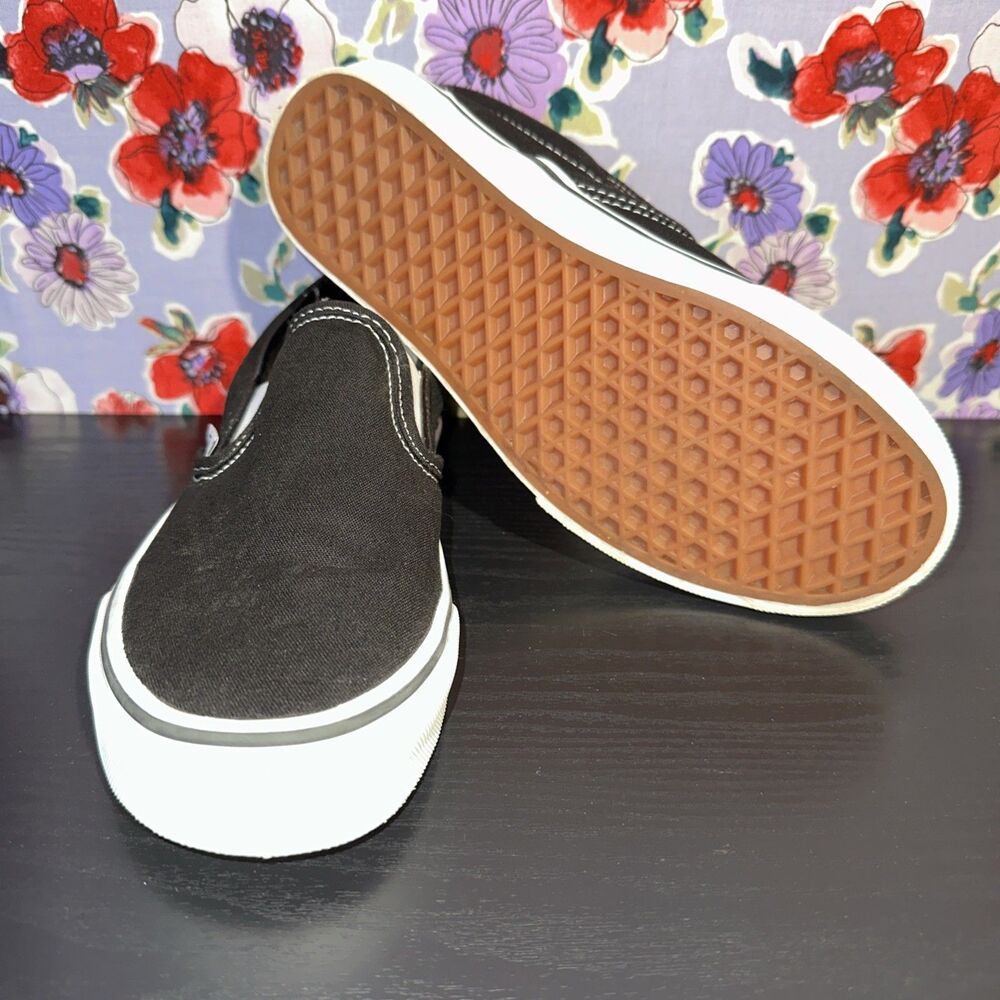 Vans Black and White Slip-On Sneakers